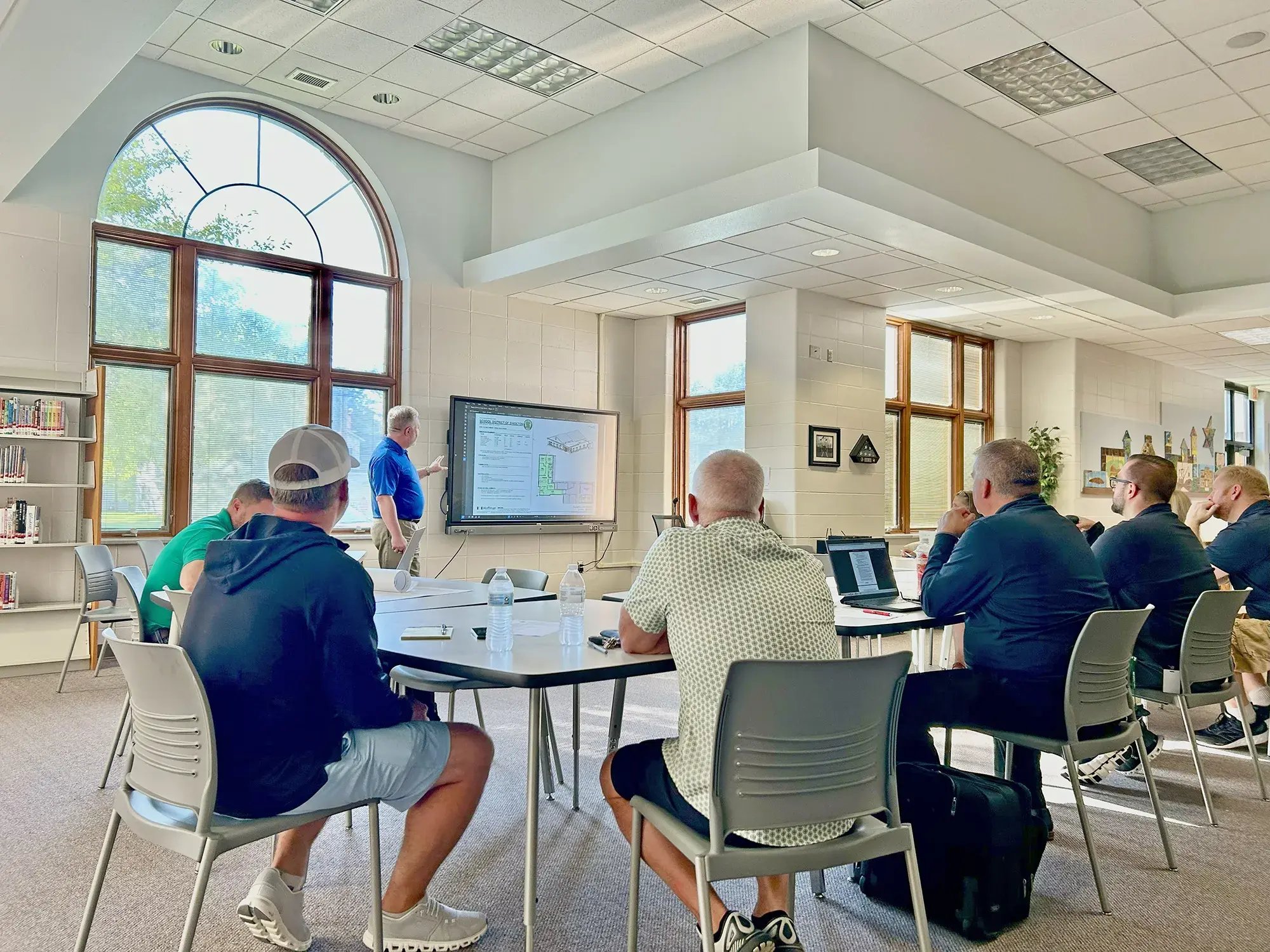 men-meeting-architectural-plans-presentation