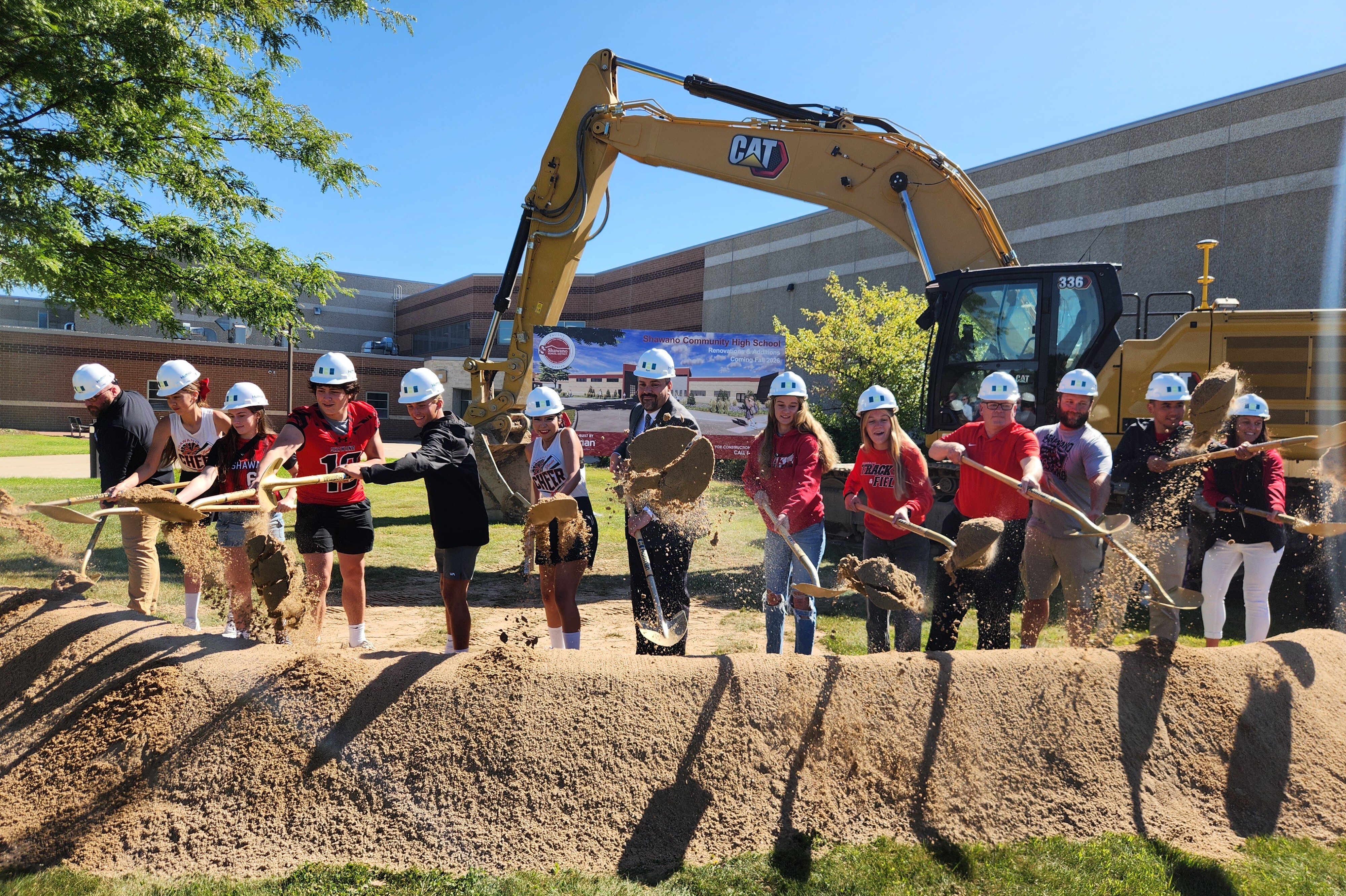 High School Students Turn Dirt During the Groundbreaking Ceremony