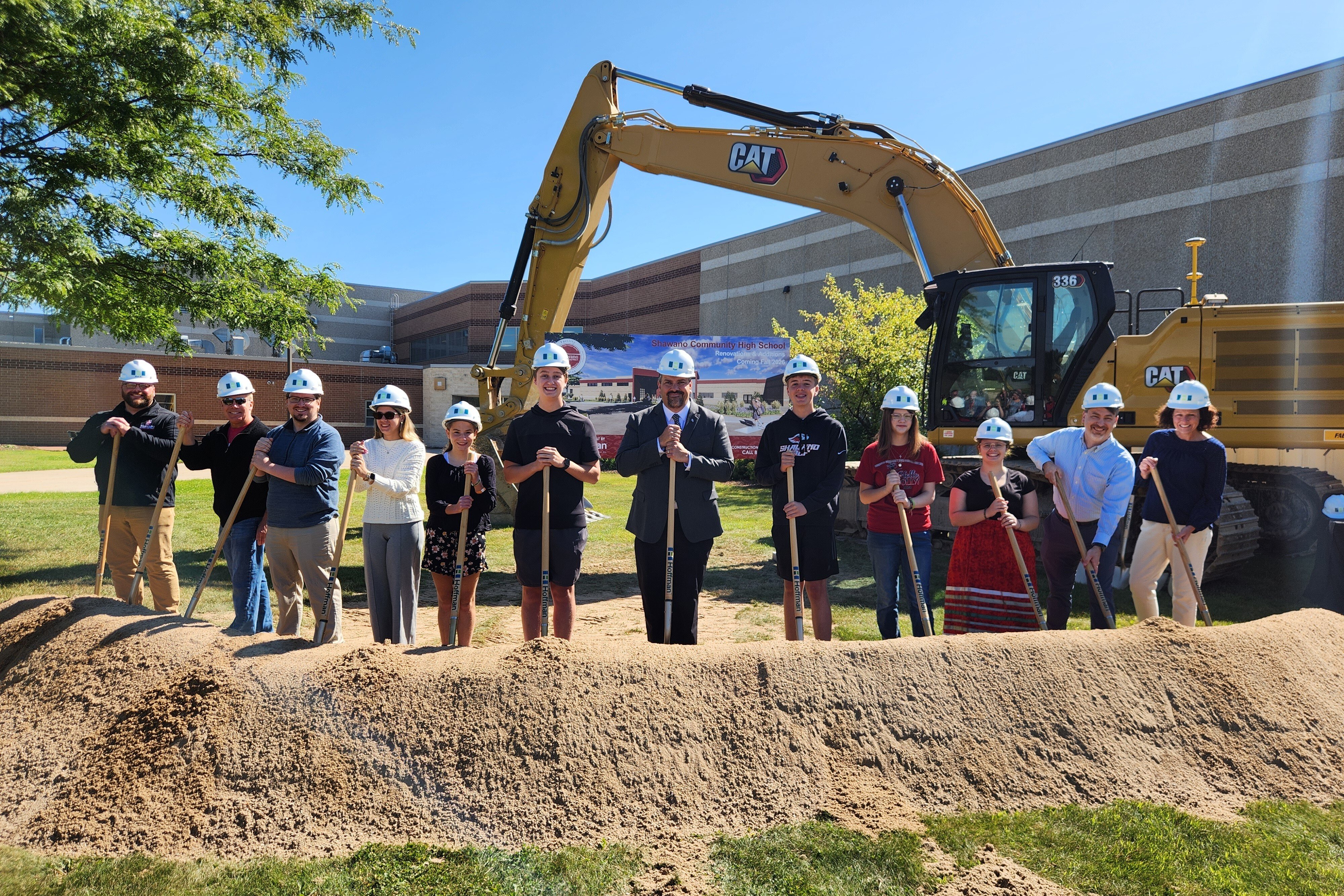 Students and Families Pose During the Groundbreaking